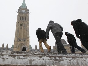 People walk towards Parliament Hill in Ottawa in this Jan. 28, 2013 file photo. (Andre Forget/QMI Agency)