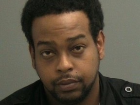 Mahad Farah, 26, is a suspect in a knifepoint robbery involving a postal worker. (OTTAWA POLICE submitted image)