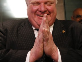 Mayor Rob Ford laughs while speaking to the media in Toronto on February 5, 2014. (Stan Behal/QMI Agency)