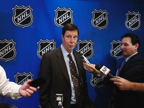 Nashville Predators general manager David Poile (left) speaks to media in New York, January 9, 2013. (REUTERS/Lucas Jackson)