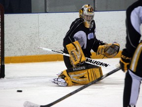 Sarnia Sting goaltender Taylor Dupuis watches a puck bounce off of his pads during a drill at practice on Wednesday, Feb. 5. The team is gearing up for an Eastern Conference road trip that begins Friday night with a trip to Ottawa. (SHAUN BISSON, The Observer)
