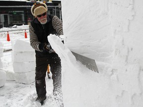 Detroit's Bob Fulks works on a snow sculpture Thursday for the 23rd annual Sarnia Snowfest this weekend. He's part of one of five teams competing at this year's snow celebration in downtown Sarnia. For more coverage turn to A3. TYLER KULA/ THE OBSERVER/ QMI AGENCY