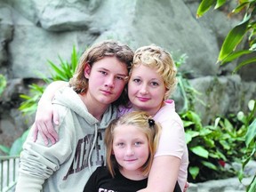 Breast cancer survivor Emily Beeckman with son Jared, 15, and daughter Tia, 11, who all appear in the short film Mom Has Cancer where they talk about the impact of breast cancer on Beeckman.
