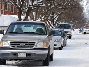 BELLEVILLE, ON (02/06/2014) Vehicles are shown here parked on George Street in Belleville. City staff say streets are getting narrower due to snow and people parking on streets. Parking on city streets is prohibited at night, and a few residents had their cars towed Wednesday night.