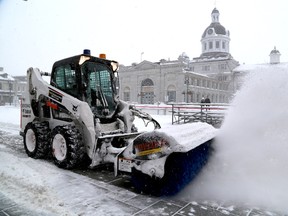 Kingston city worker Matt Butterill snowplows around the skating surface at Springer Market Square on Wednesday during another winter storm to hit the city.    
IAN MACALPINE/KINGSTON WHIG-STANDARD/QMI AGENCY