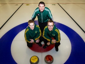 Rob Krepps poses with current U of A curler Thomas Scoffin, left, and alumnus Brendan Bottcher. (Edmonton Sun file)