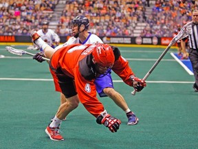 The Toronto Rock traded away Stephen Hoar, seen here bowling over a Calgary Roughneck, this week for draft picks. (ERNEST DOROSZUK/Toronto Sun)