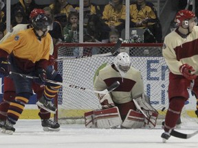 Queen's Gaels forward Joey Derochie beats Royal Military College Paladins goaltender Evan Deviller for the first goal of the game during the first period of the Carr-Harris Cup at the Rogers K-Rock Centre Thursday night. RMC won 2-1. (Julia McKay/The Whig-Standard)