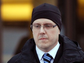 Phillip Nolan walks out of the Ottawa Courthouse on Thursday Feb. 6, 2014. (Darren Brown/QMI Agency)