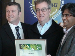 IceNet CEO Kalai Kalaichelvan (second from right) receives a Community Champions certificate from Coun. Tim Tierney, Mayor Jim Watson and Coun. Mark Taylor after announcing free wi-fi for 25 city facilities at City Hall on Friday, Feb. 7, 2014. Jon Willing/Ottawa Sun