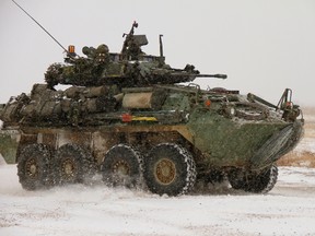 A Coyote light armoured vehicle travels on a road at CFB Wainwright, Alberta. (GRANT CREE/DND FILE)