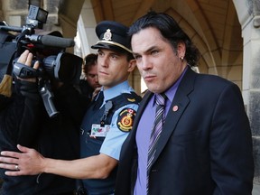 Senator Patrick Brazeau leaves Parliament Hill in Ottawa, Ontario in this October 23, 2013 file photo. (REUTERS/Chris Wattie/Files)