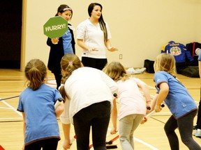 With a little help from a big sign, and someone to spin it as it read ‘Whoa’ on the other side, Kathleen Dunbar teaches young curlers what the language of the game, and sweeping, is all about at a recent class in Parkland County. - Gord Montgomery, Reporter/Examiner