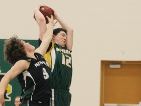 Colby Henkel of the Marauders (12) out-battles an opponent from Peace River for a rebound during semi-final action at the Stony tournament. - Gord Montgomery, Reporter/Examiner