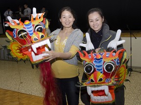 Meilan Fan (left) and Yong Qing Zhuang show off some decorative dragon heads that will help highlight the festivities at the Chinese New Year Celebrations on Saturday, Feb. 8  which will be held at the Our Lady of Fatima Parish. 
JULIA MCKAY/KINGSTON WHIG-STANDARD/QMI AGENCY