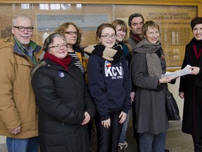 David Kerr (left), Katherine Rudder, Lindsay Davidson, Sarah Gordon, Rosemary Bakhurst, Carl Bray and Christine Sypnowich present the Save Kingston City Schools legislative petition to local NDP candidate Mary Rita Holland at Kingston Collegiate on Friday.  Holland will forward the petition on to the NDP education critic, Peter Tabuns, to present to the Ontario Legislature later this month.
JULIA MCKAY/KINGSTON WHIG-STANDARD/QMI AGENCY