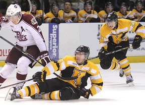 Kingston Frontenacs' Mikko Vainonen goes to the ice as he tangles with the Peterborough Petes' Nick Ritchie near centre ice during Friday night's OHL game at the Rogers K-Rock Centre. Ritchie had five goals in the Petes' 7-6 shootout loss to Kingston, helping to earn him the Ontario Hockey League player of the week honours. 
Michael Lea/Kington Whig-Standard/QMI Agency