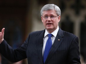 Prime Minister Stephen Harper speaks during Question Period in the House of Commons on Parliament Hill in Ottawa in this April 15, 2013 file photo. (REUTERS/Chris Wattie)