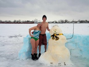 Submitted photo
Michael Dijkhuis and his wife Annemarie Dijkhuis pose with a snowman they built on the St. Clair River near Port Lambton on the weekend. Shortly after posing for this picture with Kees the snowman, the ice cracked and the snowman eventually made its way downstream. If you see a snowman moving its way down the Detroit River, then to Lake Erie and eventually over the Niagara Falls, you will know where it originated.