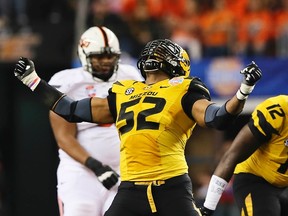 Missouri Tigers defensive lineman Michael Sam (52) reacts after a play during the second half against the Oklahoma State Cowboys in the 2014 Cotton Bowl at AT&T Stadium in Arlington, Texas in this January 13, 2014 file photo. (Kevin Jairaj/USA TODAY Sports)