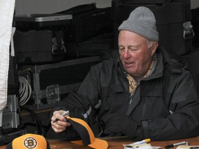 Hockey Hall of Famer and former Boston Bruins goalie Gerry Cheevers signed autographs in Springer Market Square on Saturday during FebFest. (Julia McKay The Whig-Standard)