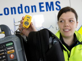 Primary care paramedic Kelly Fletcher shows off a compact carbon monoxide detector, which alerts emergency medical workers to high CO levels. The devices are standard equipment for all Middlesex-London ambulances. (CRAIG GLOVER, The London Free Press)