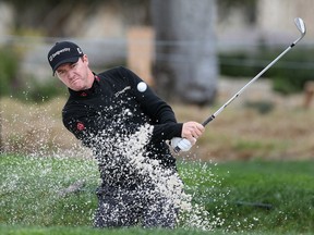 Jimmy Walker hits out of the bunker on the second hole during the final round of the AT&T Pebble Beach National Pro-Am at the Pebble Beach Golf Links on February 9, 2014 in Pebble Beach, California. (Christian Petersen/Getty Images/AFP)