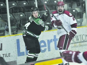 Terriers forward Dane Schioler battles with Virden's Curtis Houlden during Portage's 5-2 win Feb.9. (Kevin Hirschfield/THE GRAPHIC/QMI AGENCY)