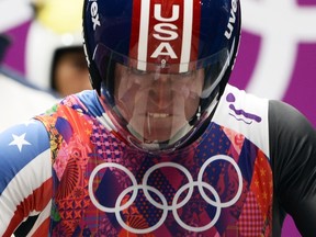 American luger Tucker West competes during the men's luge singles at the Sliding Center Sanki during the Sochi Winter Olympics on February 8, 2014.  (AFP PHOTO / LIONEL BONAVENTURE)