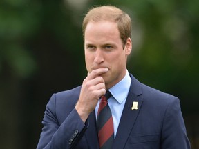 Britain's Prince William watches a Southern Amateur League football match in the grounds of Buckingham Palace, in central London on October 7, 2013. (REUTERS/Toby Melville)