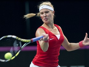 Eugenie Bouchard of Canada returns to Vesna Dolonc of Serbia during Fed Cup play in Montreal. (JOEL LEMAY/QMI Agency)