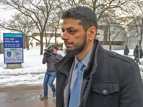 Dr. Khurram Syed Sher walks outside the Ottawa courthouse, where is he facing trial on terror-related charges. (DARREN BROWN Ottawa Sun)