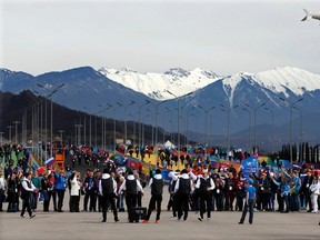 Performers dance as spectators arrive at the Olympic Park for the 2014 Sochi Winter Olympics, February 9, 2014. (REUTERS)