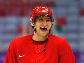 Russia's Alexander Ovechkin laughs during his team's first practice at the 2014 Sochi Winter Olympics, February 10, 2014. (REUTERS)