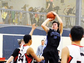 Derek Elliott (right) of the MDHS Senior boys basketball team makes a successful jump shot during Huron-Perth regular season action last Monday, Feb. 3 against South Huron. Elliott scored 12 points in a 54-33 win. ANDY BADER/MITCHELL ADVOCATE