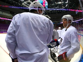 Team USA's James van Riemsdyk (L) and Phil Kessel talk during the men's ice hockey team's first practice at the 2014 Sochi Winter Olympics, February 10, 2014. (REUTERS)