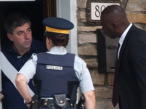 Adriano Furgiuele, a former employee at the Canada Revenue Agency, is pictured in this August 9, 2012 photo being arrested by the RCMP. (QMI Agency files)