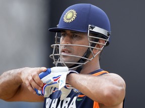 India’s Mahendra Singh Dhoni is under the gun after yet another Test defeat on foreign soil — the 11th in 13 matches. (AFP)