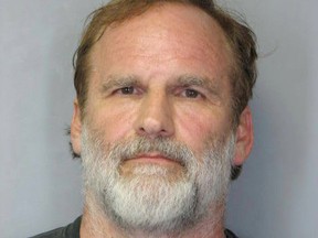 Dr. Melvin Morse, pictured, a Delaware pediatrician specializing in the near-death experiences of children, is accused of waterboarding his 11-year-old stepdaughter. (Handout/Delaware State Police)
