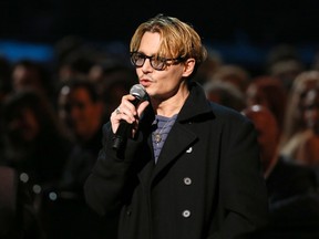 Actor Johnny Depp speaks during the taping of "The Night That Changed America: A Grammy Salute To The Beatles", which commemorates the 50th anniversary of The Beatles appearance on the Ed Sullivan Show, in Los Angeles January 27, 2014. (REUTERS/Mario Anzuoni)