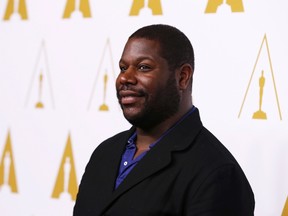 Best director nominee Steve McQueen arrives at the 86th Academy Awards nominees luncheon in Beverly Hills, California February 10, 2014. (REUTERS/Mario Anzuoni)