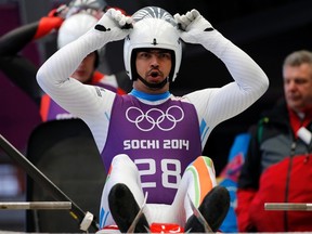 India's Shiva Keshavan prepares for the start during the men's luge training at the Sanki sliding center in Rosa Khutor, a venue for the Sochi 2014 Winter Olympics near Sochi February 5, 2014. (REUTERS/Fabrizio Bensch)