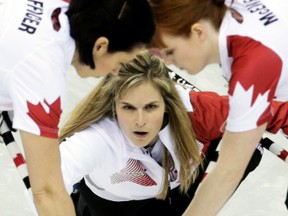 Canada's skip Jennifer Jones delivers a stone in their women's curling round robin game against Sweden at the Sochi 2014 Winter Olympic Games, Feb. 11, 2014. (INTS KALNINS/Reuters)