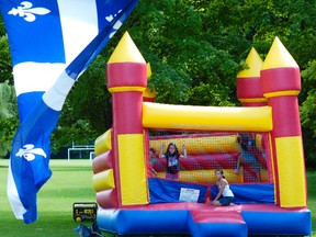 Children playing inside a bouncy castle June 23, 2012 at Beavermead Park in Peterborough, Ont. (CLIFFORD SKARSTEDT/QMI AGENCY FILE PHOTO)