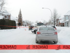 Three bodies were found by authorities in a residence inTrois-Rivières, Que. Tuesday, Feb. 11, 2014. Two people were arrested.
(CLAUDIA BERTHIAUME / QMI AGENCY)