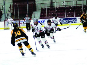 Saints player Lexi Williams takes the puck towards Fort Frances’ end followed by teammate Carissa Heino while Muskies player Shilo Beck stands in the way during their game on Monday, Feb. 10.