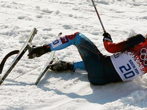 Russia's Anton Gafarov lies on the ground after crashing in the men's cross country sprint semifinals at the Sochi 2014 Winter Olympic Games in Rosa Khutor, Feb. 11, 2014. (STEFAN WERMUTH/Reuters)