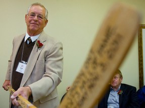 Doug Jarrett of London, an original six Chicago Black Hawks NHL all-star shows off an all wood hockey stick that he signed before the London Sports Hall of Fame induction ceremony Thursday November 3, 2011.
(MIKE HENSEN/THE LONDON FREE PRESS/QMI AGENCY)