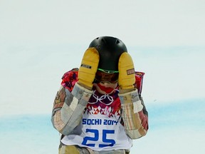 Shaun White of the U.S. reacts after crashing during the men's snowboard halfpipe final event at the 2014 Sochi Winter Olympic Games, in Rosa Khutor February 11, 2014. (REUTERS)