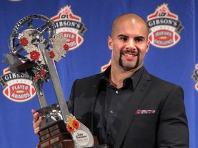 Shea Emry holds his trophy after winning Jake Gaudaur award during the annual CFL player awards ahead of the 101st Grey Cup in Regina, Sask., on Thursday November 21, 2013. (Al Charest/QMI Agency)